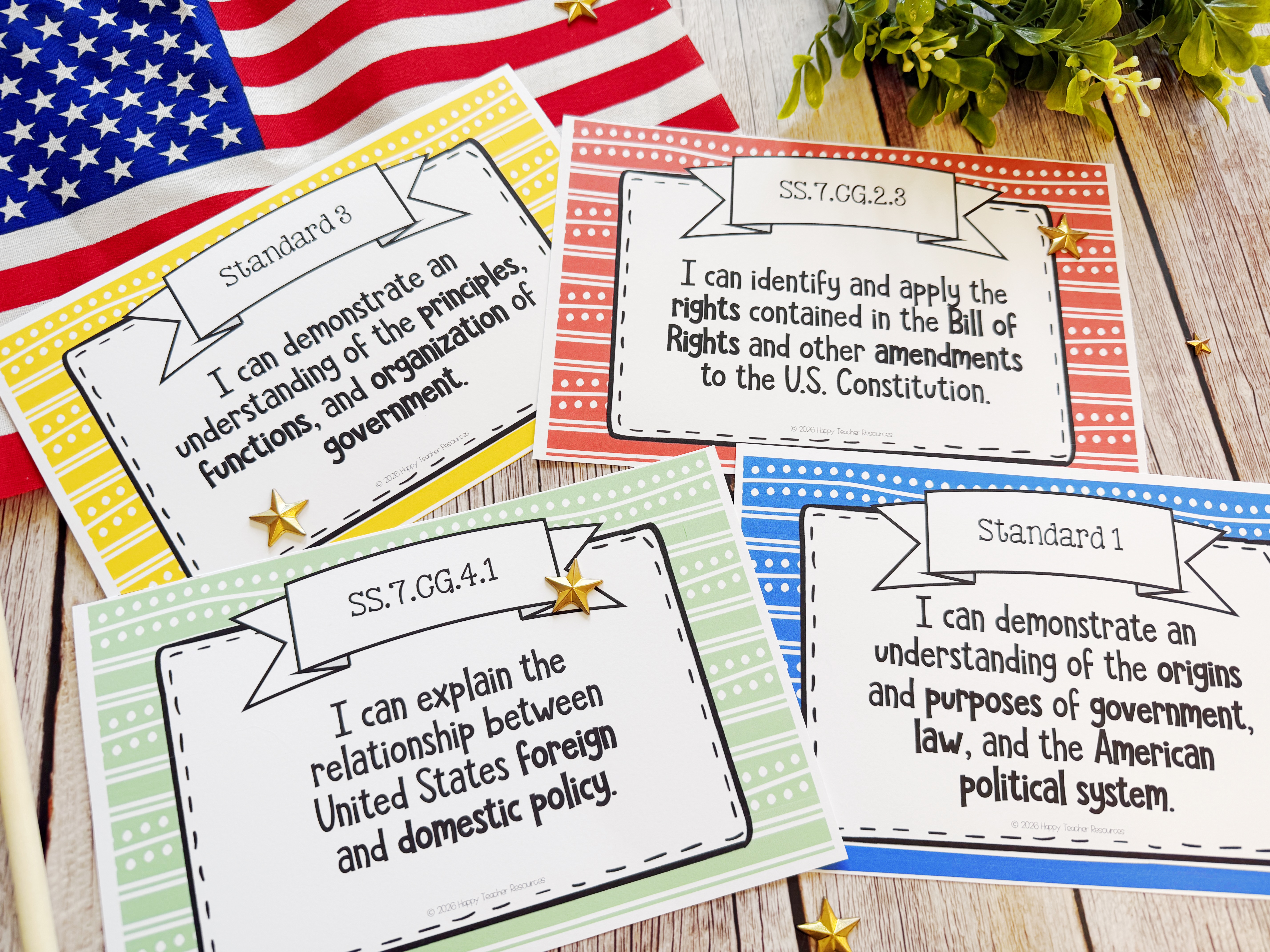 Four sample Civics Standards Posters are displayed on a tabletop. Perfect for decorating your classroom with your daily curriculum objectives!
